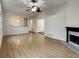Bright living room featuring hardwood floors, a fireplace, and a ceiling fan at 832 Overlook Trl, Canton, GA 30115