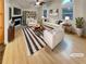 Bright, staged living room featuring vaulted ceilings, fireplace, and modern furnishings at 832 Overlook Trl, Canton, GA 30115