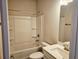 Clean, bright bathroom with shower-tub combo, vanity and modern fixtures at 112 Scarlett Place Dr, Bowdon, GA 30108