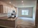 Modern kitchen featuring stainless steel appliances, granite countertops, and an open layout at 112 Scarlett Place Dr, Bowdon, GA 30108