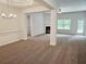 Spacious living room with a fireplace, ample natural light, and an open floor plan perfect for entertaining at 112 Scarlett Place Dr, Bowdon, GA 30108