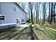 Exterior of home showing backyard, concrete patio, and mature trees at 2076 Greenridge Se Rd, Smyrna, GA 30080
