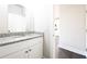 Stylish half bathroom features a granite countertop, white cabinetry, and neutral walls at 2076 Greenridge Se Rd, Smyrna, GA 30080