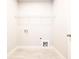 This small, functional laundry room has tile floor and wire shelving at 2076 Greenridge Se Rd, Smyrna, GA 30080
