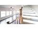 Bright living room with hardwood floors, large windows and a ceiling fan, flowing into an open kitchen at 2076 Greenridge Se Rd, Smyrna, GA 30080