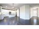 Open-concept living space with views of the kitchen and entry, featuring hard wood floors and lots of light at 2076 Greenridge Se Rd, Smyrna, GA 30080