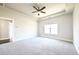 Spacious main bedroom featuring tray ceilings, carpet flooring, and ensuite bathroom at 2076 Greenridge Se Rd, Smyrna, GA 30080