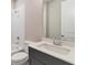 Clean bathroom featuring modern fixtures, including a sleek vanity, toilet, and shower with white tile at 333 Willow Cv, Canton, GA 30114