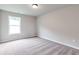 Neutral bedroom with carpet floors and lots of natural light from a bright window at 333 Willow Cv, Canton, GA 30114