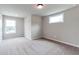 Well-lit bedroom with two windows, neutral walls, and carpeted floors at 333 Willow Cv, Canton, GA 30114