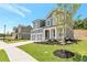 Beautiful two-story home featuring a two-car garage and professionally landscaped front yard with manicured lawn at 333 Willow Cv, Canton, GA 30114