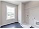 Bright laundry room with tile flooring and a window at 333 Willow Cv, Canton, GA 30114
