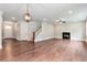 Spacious living room showcasing hardwood floors, a fireplace, and a blend of modern and cozy elements at 333 Willow Cv, Canton, GA 30114