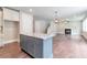 Open-concept living room features hardwood floors and a cozy fireplace at 333 Willow Cv, Canton, GA 30114