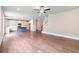 Inviting open-concept living space with a modern kitchen, hardwood floors, and staircase, promoting seamless living at 333 Willow Cv, Canton, GA 30114