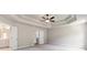 Spacious bedroom featuring a tray ceiling and plush carpeting at 333 Willow Cv, Canton, GA 30114