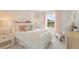 Charming bedroom with a canopy bed, floral accents, and soft lighting at 5523 Rosehall Pl, Atlanta, GA 30349
