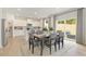 Light-filled dining area next to the kitchen with outdoor access to backyard at 5523 Rosehall Pl, Atlanta, GA 30349