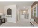 A hallway features a chalkboard wall, art pieces, and neutral walls, creating a welcoming atmosphere at 5523 Rosehall Pl, Atlanta, GA 30349