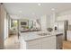 Spacious kitchen features granite countertops, stainless steel appliances, and a seamless flow into the dining and living areas at 5523 Rosehall Pl, Atlanta, GA 30349