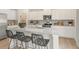 Modern kitchen features granite countertops, stainless steel appliances, and a center island with bar stool seating at 5523 Rosehall Pl, Atlanta, GA 30349