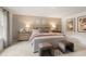 This main bedroom has a large bed, coordinated linens, and dual nightstands with lamps at 5523 Rosehall Pl, Atlanta, GA 30349