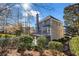 Exterior backyard view highlighting the deck, patio, brick accents, and landscaped greenery at 1129 Gavinwood Pl, Decatur, GA 30033