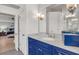 Bathroom view with marble countertop, blue vanity, and a view to the bedroom at 1129 Gavinwood Pl, Decatur, GA 30033