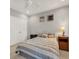 Bedroom with grey walls features carpeted floors, a double door closet, and a bed with a striped bedspread at 1129 Gavinwood Pl, Decatur, GA 30033