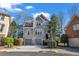 Beautiful two-story home with brick and stone exterior and two car garage on a sunny day at 1129 Gavinwood Pl, Decatur, GA 30033