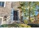 Close up of the front entrance featuring a black door with metal hardware and ornate wall lighting at 1129 Gavinwood Pl, Decatur, GA 30033