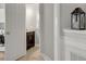 View into a laundry room with a washing machine and a dark wood vanity with a light countertop at 1129 Gavinwood Pl, Decatur, GA 30033