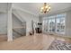 Bright living room with hardwood floors, large windows, and elegant trim at 1129 Gavinwood Pl, Decatur, GA 30033