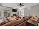 Inviting living room with hardwood floors, a fireplace, large windows and comfortable seating arrangement at 1129 Gavinwood Pl, Decatur, GA 30033