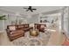 Spacious living room featuring hardwood floors, a leather sectional sofa, and an open floor plan at 1129 Gavinwood Pl, Decatur, GA 30033