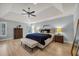 Spacious bedroom with a tray ceiling, a ceiling fan, and lots of natural light at 1129 Gavinwood Pl, Decatur, GA 30033