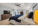 Large bedroom with light blue walls, hardwood floors, and bright natural lighting at 1129 Gavinwood Pl, Decatur, GA 30033