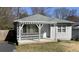 Cozy home with a welcoming front porch, new gray paint and nice architectural details at 1649 Ezra Church Nw Dr, Atlanta, GA 30314