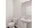 Clean bathroom features a pedestal sink and toilet at 2761 Honey Locust, Loganville, GA 30052