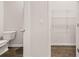 Bathroom and closet feature tile floors and provide storage space at 2761 Honey Locust, Loganville, GA 30052