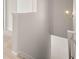This is a hallway with neutral paint, crown moulding, and a modern light fixture at 2761 Honey Locust, Loganville, GA 30052