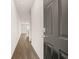 Inviting hallway features wood floors, neutral walls, and an open floor plan at 2761 Honey Locust, Loganville, GA 30052