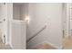 Hallway with neutral paint, crown moulding, and a modern light fixture at 2761 Honey Locust, Loganville, GA 30052