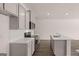 Modern kitchen boasts stainless steel appliances, white countertops, and ample cabinet space at 2761 Honey Locust, Loganville, GA 30052