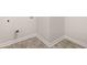 Laundry room with neutral paint, washer hook ups, and luxury vinyl flooring at 2761 Honey Locust, Loganville, GA 30052