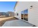 This backyard features a concrete patio and view of neighboring houses at 5527 Rosehall Pl, Atlanta, GA 30349