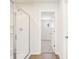 This bathroom has a shower with glass doors and a view into a walk-in closet at 5527 Rosehall Pl, Atlanta, GA 30349