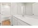 Bright bathroom with white vanity, framed mirror, and a shower-tub combination at 5527 Rosehall Pl, Atlanta, GA 30349