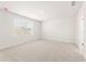 Bedroom features natural light, soft carpet, and a calming, neutral color palette at 5527 Rosehall Pl, Atlanta, GA 30349