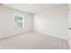 Bright bedroom with plush carpet, large windows, and ample natural light at 5527 Rosehall Pl, Atlanta, GA 30349